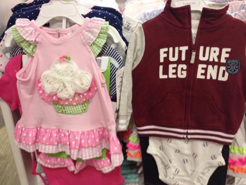 Clothing from the girls' section: a pink, cute-looking cupcake. Clothing from the boys' section: the words "Future Legend" and baseballs.